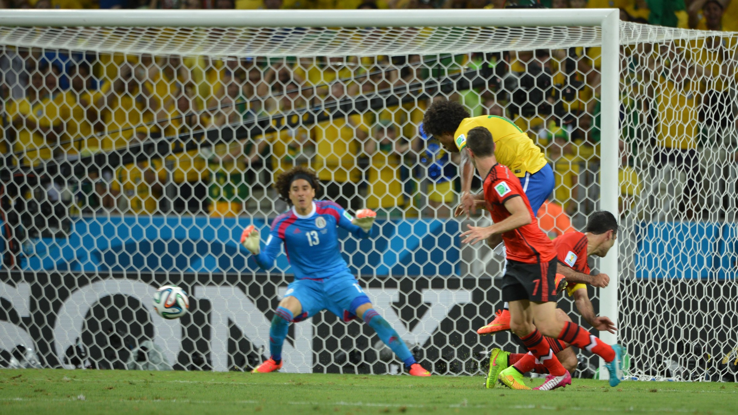 Guillermo Ochoa set in goal for Mexico during the 2014 World Cup match against Brazil.