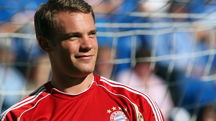 Manuel Neuer in Bayern Munich's red kit, in front of the goal.